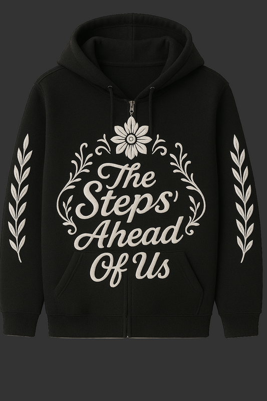 Black hoodie with white floral design and text on a black background