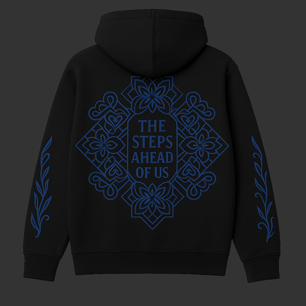 Black hoodie with blue floral design and text on the back against a cream background